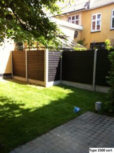 Sort havehegn i solskinsbelyst have